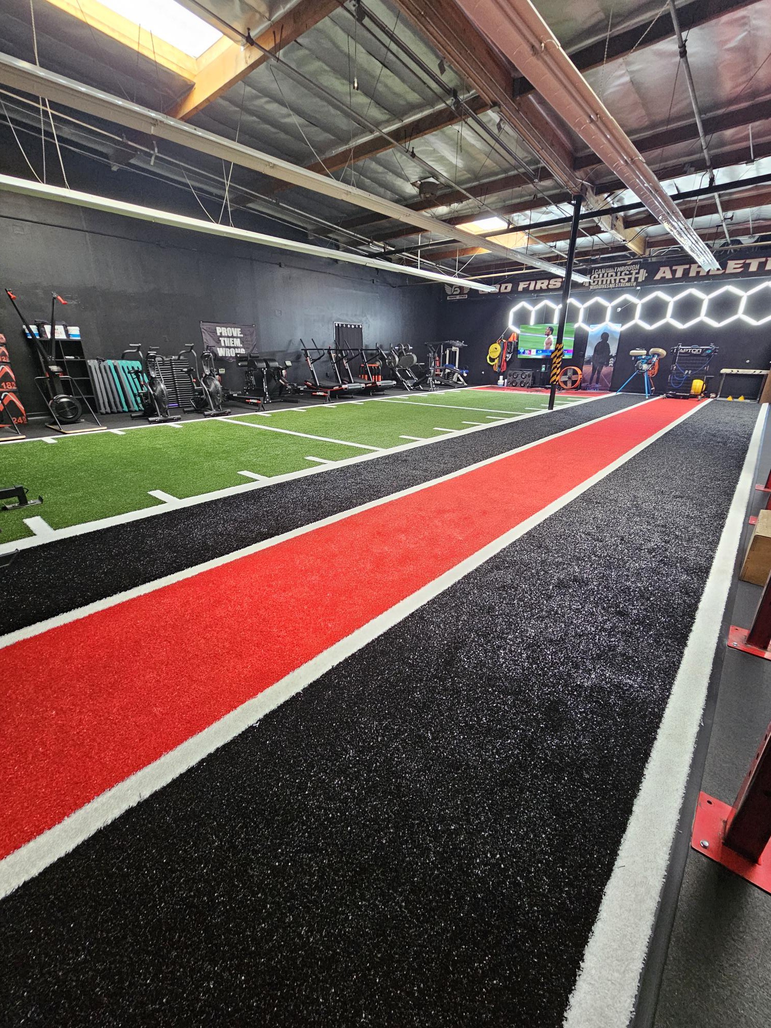 FFP performance turf with red sprint lane and green agility strip at G1 Athletics
